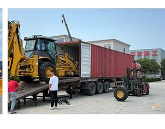 Backhoe loader driven into a container via ramp