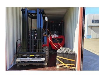 Forklift loaded inside a shipping container