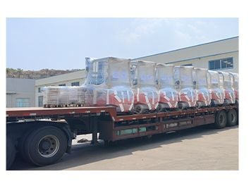 Machines wrapped for transport on a flatbed trailer